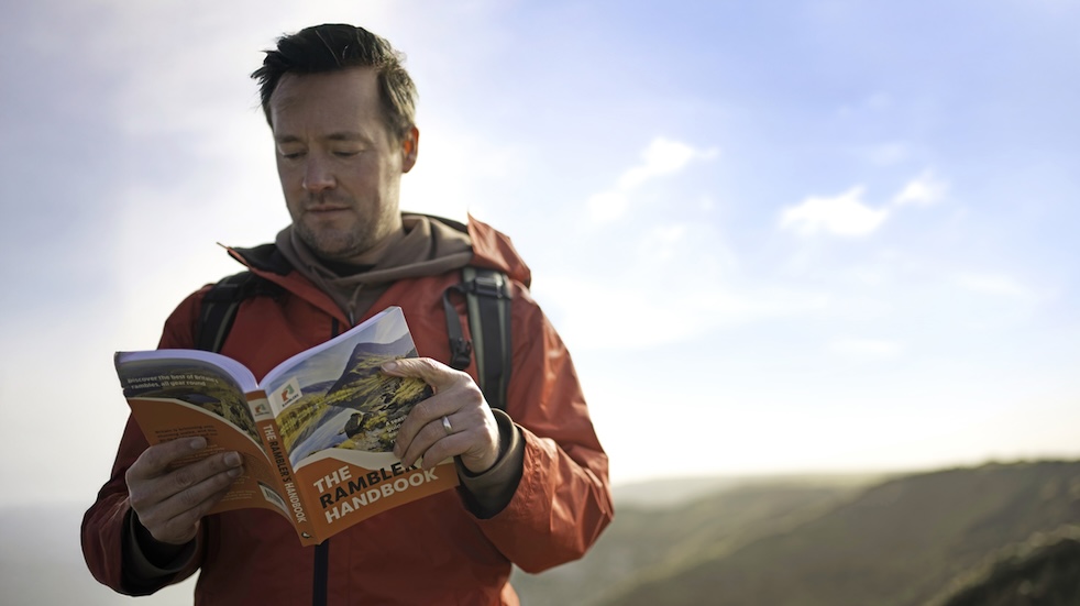 Sam Philip reading the Ramblers handbook